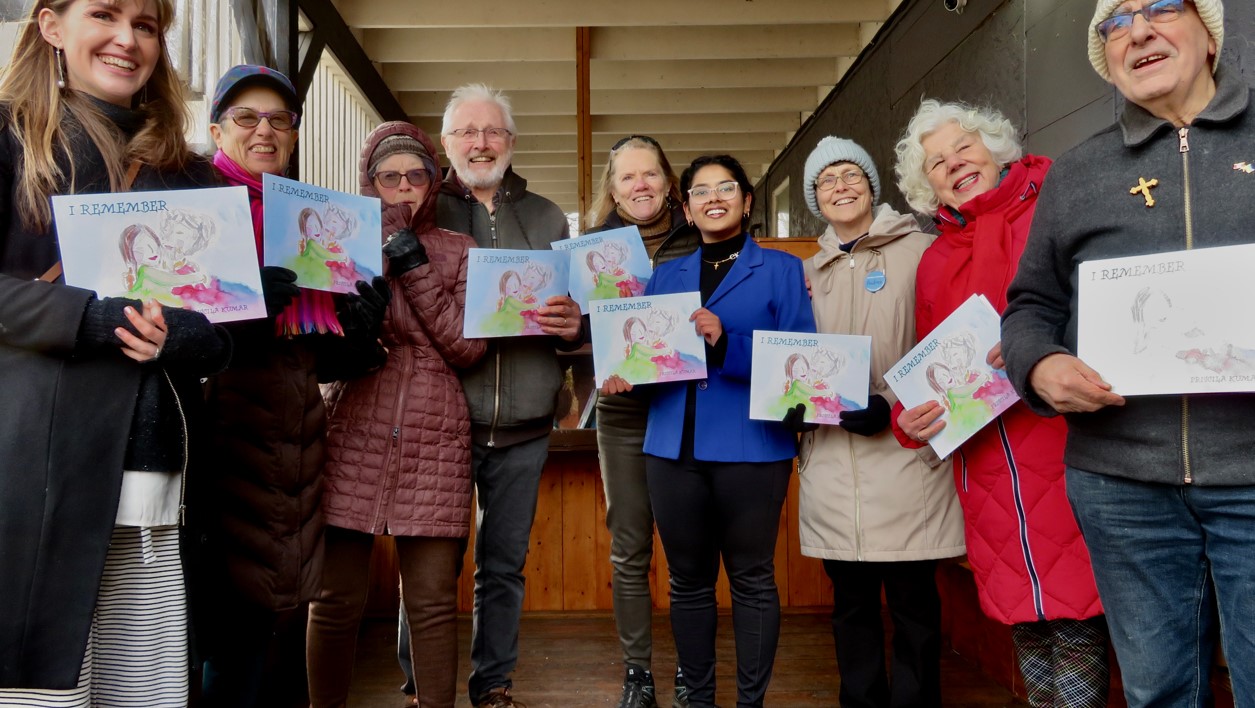 Voices in Motion choristers serenade local little free library